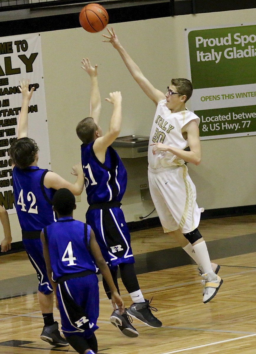 Image: Michael Hughes(20) floats a one-handed shot over the Rice Bulldog defenses.