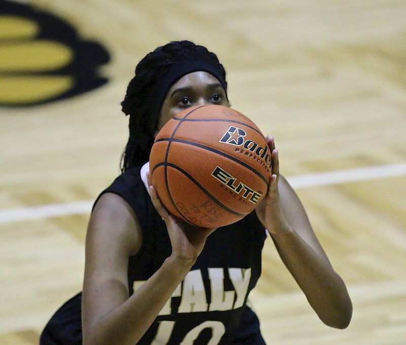 Image: Janae Robertson(10) is focused at the free-throw line for Italy.