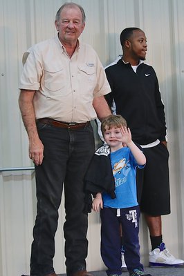 Image: Waving at the camera is IYAA C-team tight end J.C. Smith(10) after receiving his Superbowl Championship hoodie from Mayor James Hobbs. J.C. was just in Pre-K when he won his first Superbowl.