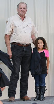 Image: City of Italy’s Mayor James Hobbs presented C-team cheerleader Shay Johnson with her Superbowl Championship hoodie.