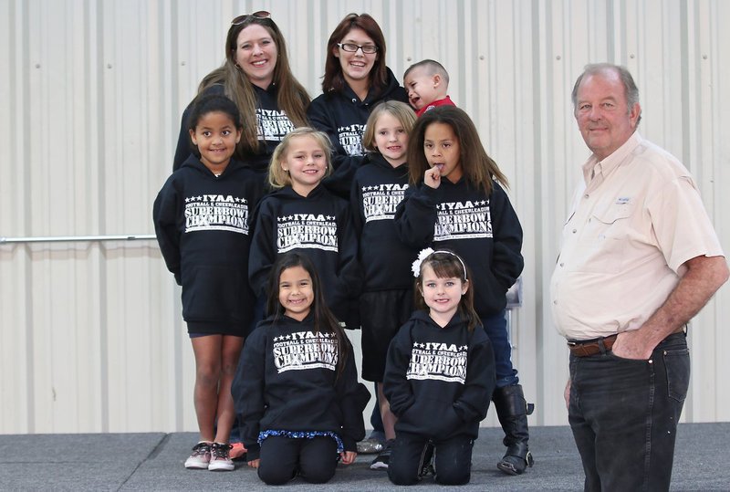 Image: The IYAA C-team cheer coaches and cheerleaders pose with City of Italy’s Mayor James Hobbs who presented the Superbowl Champion cheerleaders with their hoodies. Cheer coaches Kia Hugghins and Lindy Wooldridge are pictured on the back row. The middle row cheerleaders are Mikyla Adams, Charlea Padilla, Lily Hugghins and Shay Johnson. Front row cheerleaders are Jordynn Wiser and Sorienna Maynard.
