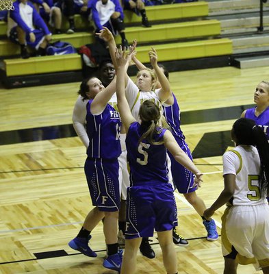 Image: Freshman Brycelen Richards(13) goes up strong to draw a shooting foul charged to Frost. Brycelen went 1-of-2 from the charity stripe.