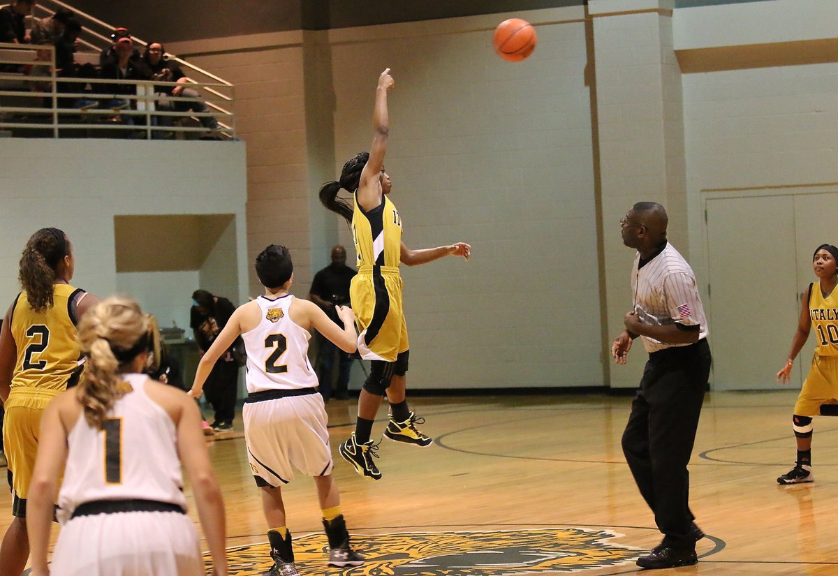 Image: Italy’s Kortnei Johnson(3) goes unchallenged by Itasca to control the opening tipoff back to teammate K’Breona Davis(10). In fact, the Lady Gladiators were in control of this one from tip to finish.