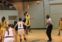 Image: Italy’s Kortnei Johnson(3) goes unchallenged by Itasca to control the opening tipoff back to teammate K’Breona Davis(10). In fact, the Lady Gladiators were in control of this one from tip to finish.