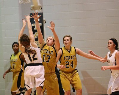 Image: Brycelen Richards(13), Lillie Perry(24) and K’Breona Davis(10) play tough for Italy’s defense.