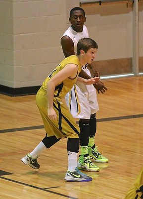 Image: Gladiator senior Gary Kincaid(2) covers Itasca’s big man on the block.