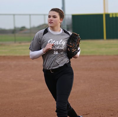 Image: Lady Gladiator Grace Haight(16) hustles in from left field after good defense by Italy.