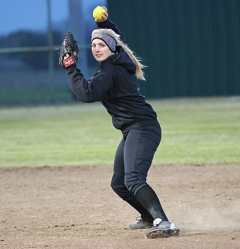 Image: Lady Gladiator shortstop Madison Washington(10) keeps shooting down the Lady Hawk runners before they can reach first-base.