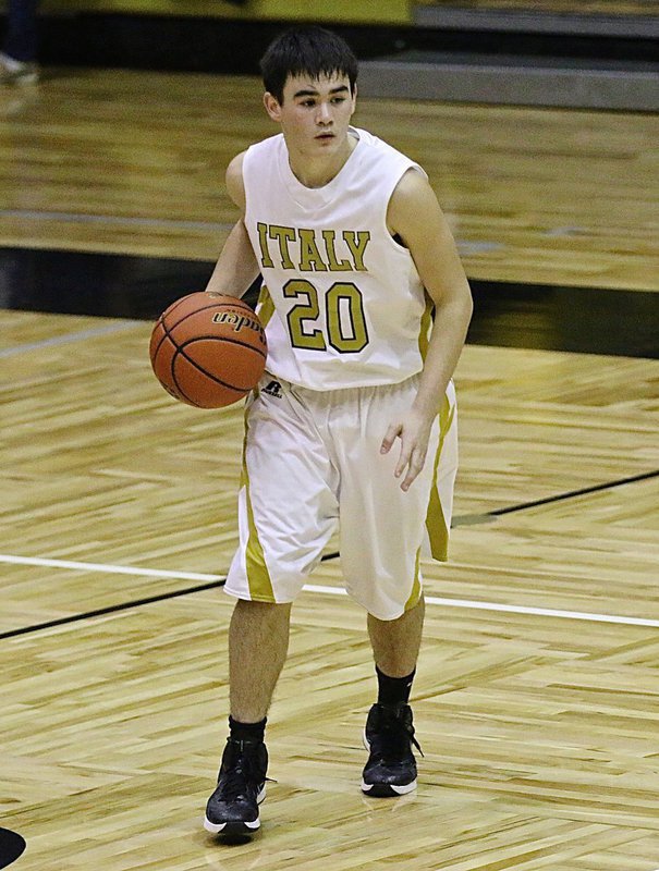 Image: Kyle Tindol(20) brings the ball the court for the Gladiators.