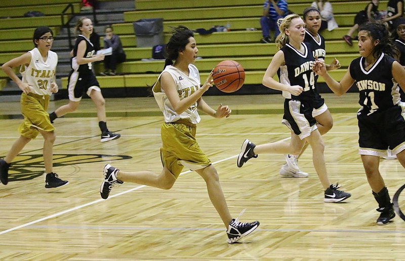 Image: Emily Guzman(15) sprints the ball across the mid line for the junior high A-team Lady Gladiators.