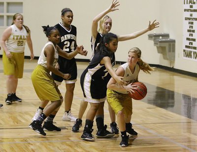 Image: Italy A-teamers Karson Holley(2) and  teammate Chardonae Talton(3) get control of an offensive rebound.