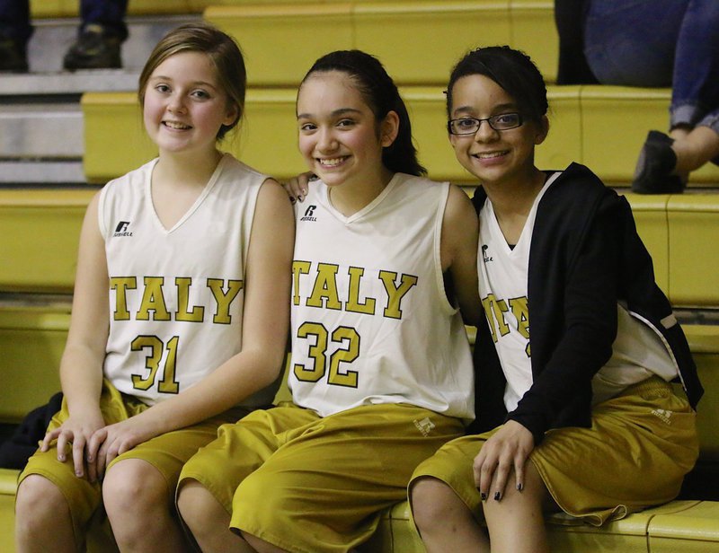 Image: Italy B-team Lady Gladiators Kaitlyn Fulgum(31) Hannah Carr(32) and Aliyah Turner(13) cheer on Italy’s A-team girls.