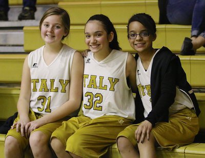 Image: Italy B-team Lady Gladiators Kaitlyn Fulgum(31) Hannah Carr(32) and Aliyah Turner(13) cheer on Italy’s A-team girls.