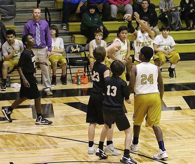 Image: Italy’s Marcos Duarte(1) pulls up from beyond the arc.