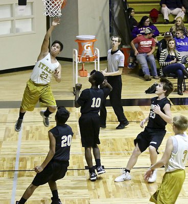 Image: Italy 8th Grader Aaron Franco(23) scores after a strong drive to the basket.