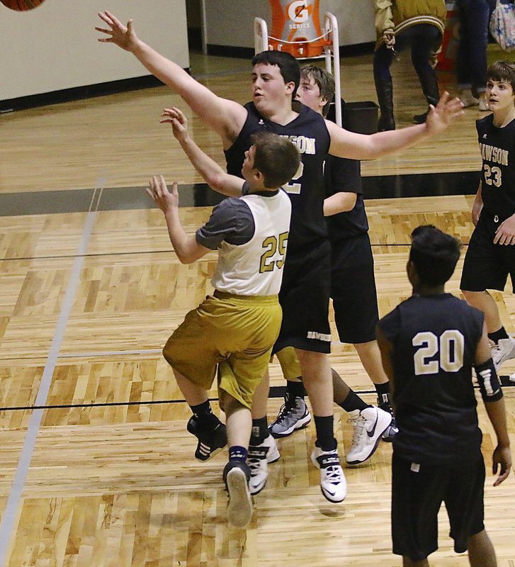 Image: Italy 8th grader Cason Roberts(25) gets a tough shot up and over Dawson’s big man.