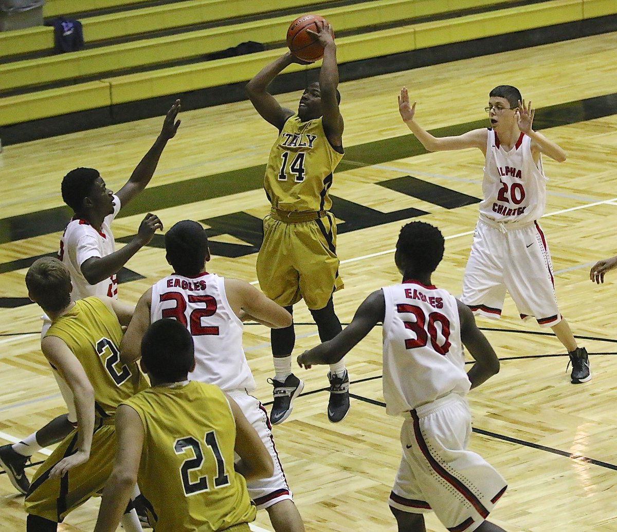 Image: Freshman Gladiator Kendrick Norwood(14) pulls up in the lane for a shot against Garland Alpha Charter.