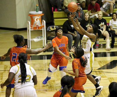 Image: Senior guard K’Breona Davis(10) takes a running jumper after getting into Gateway’s lane.
