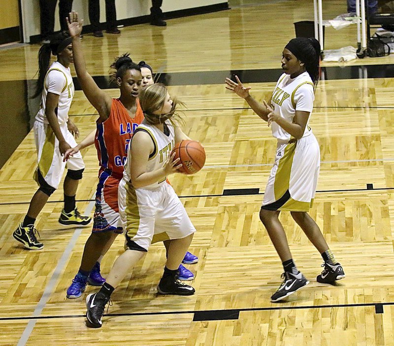 Image: Lillie Perry(24) rebounds and then finds teammate Janae Robertson(5) as these two Lady Gladiators close the door on a Gateway comeback when Robertson scored the last basket of the game. Italy wins 64-57!!!