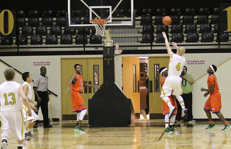 Image: Senior Gladiator Cody Boyd(4) takes a jumper over a Dallas Gateway defender.