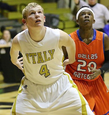 Image: Senior Gladiator Cody Boyd(4) blocks out a Gator during a free-throw.
