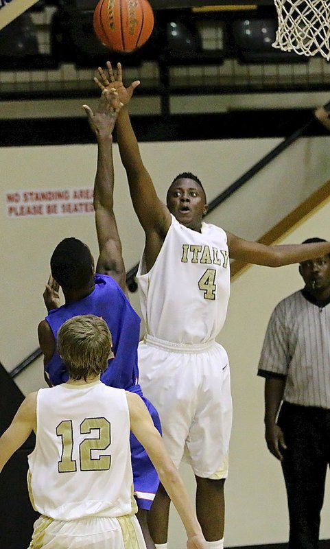 Image: JV Gladiator Anthony Lusk(4) challenges a Gateway shooter.
