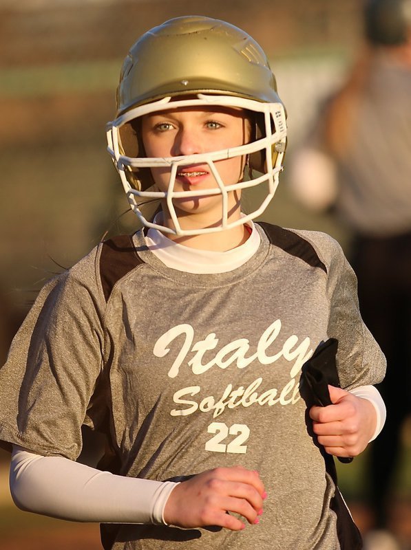 Image: Kirsten Viator(22) hustles to the dugout after scoring a run for Italy.