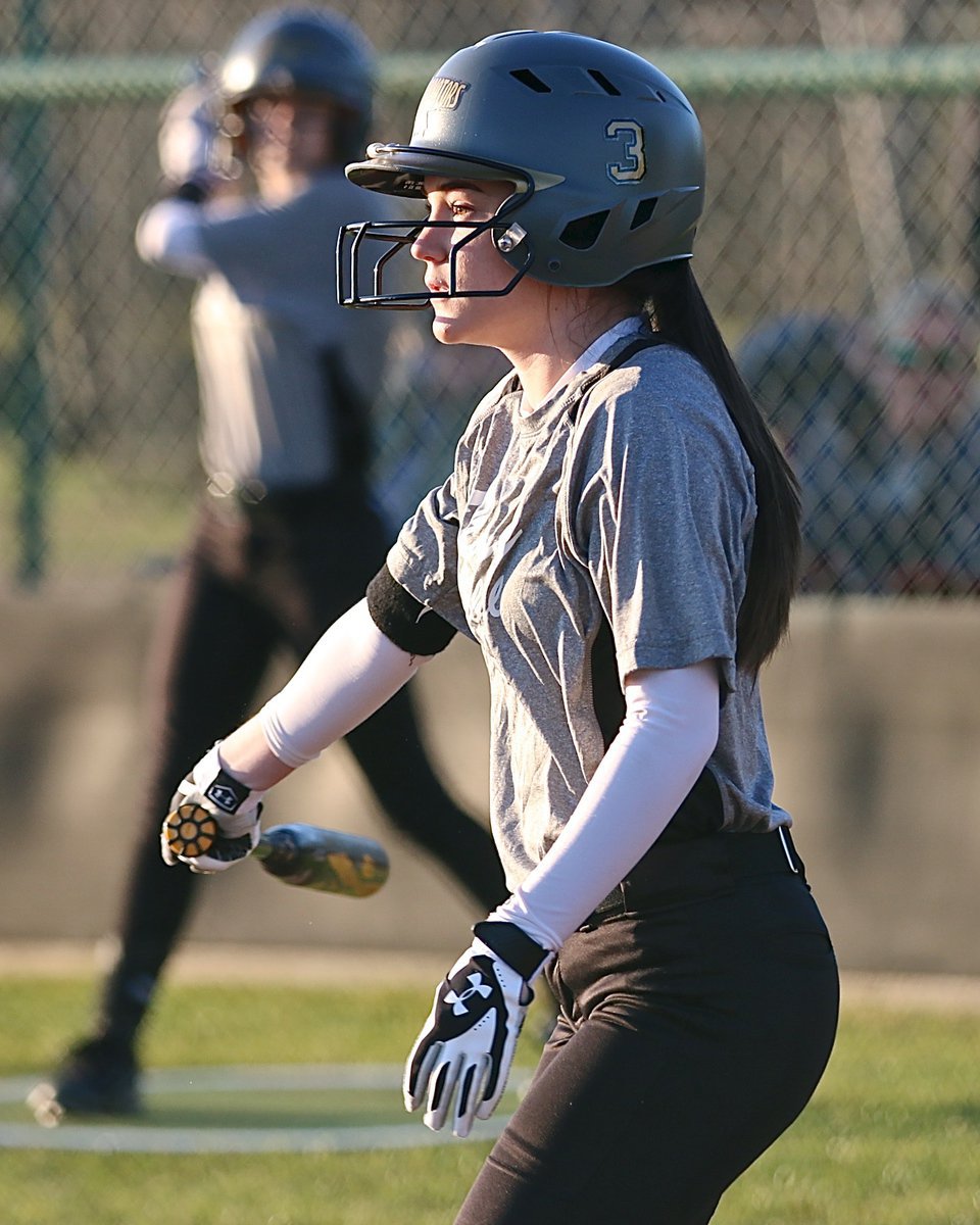 Image: Lady Gladiator Cassidy Childers(3) slaps the ball into play and then reaches first-base safely.