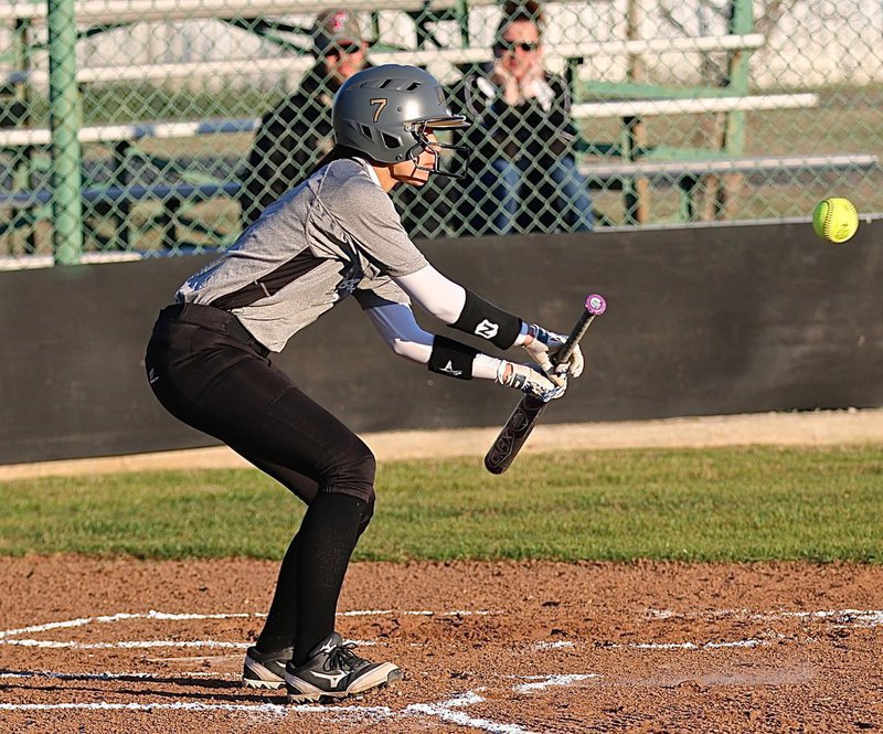 Image: Lady Gladiator April Lusk(7) taps a bunt and then outruns the throw to first-base.