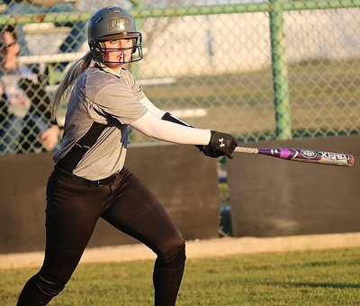 Image: Senior Lady Gladiator Madison Washington(10) drills a shot into right field knowing this could be trouble for the Red Oak Life defense.