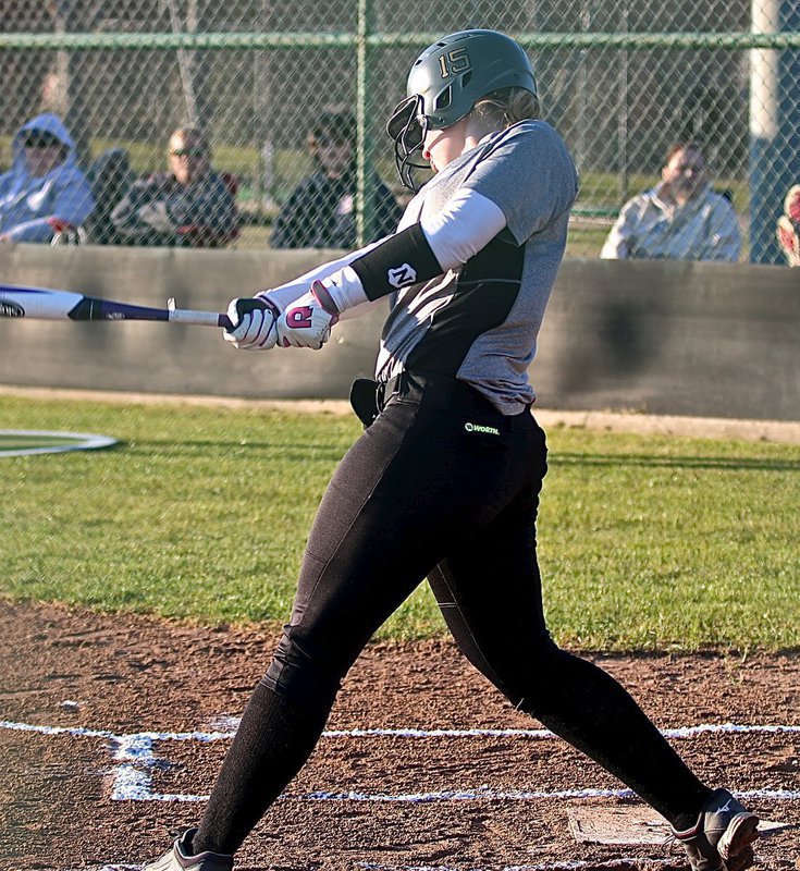 Image: Italy’s Jaclynn Lewis(15) jackhammers a shot into the left field gap.