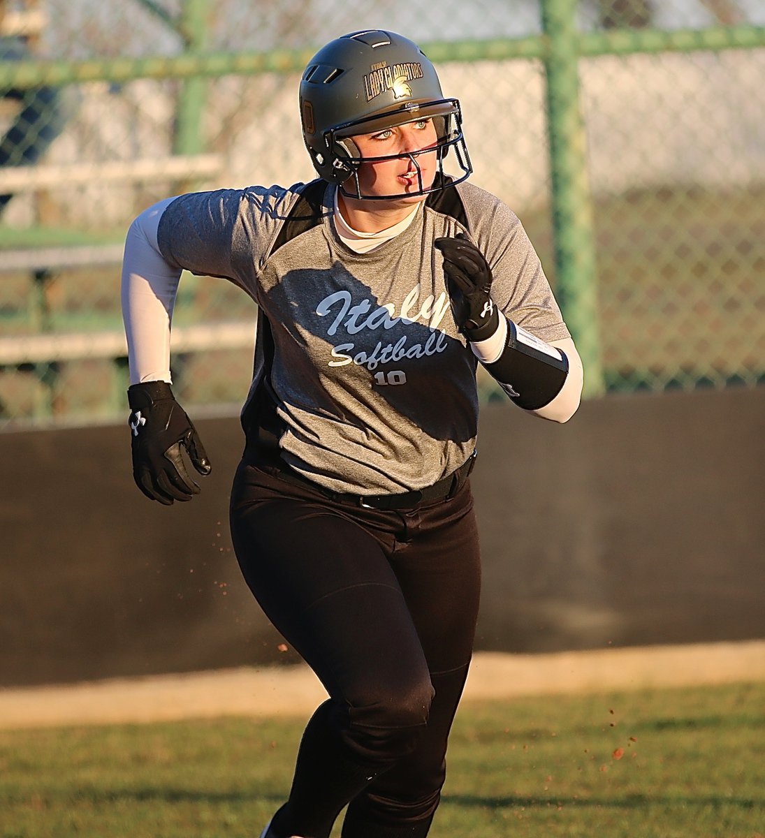 Image: Making her trek around the bases is Madison Washington(10) as Red Oak Life scrambles to relay the ball in.