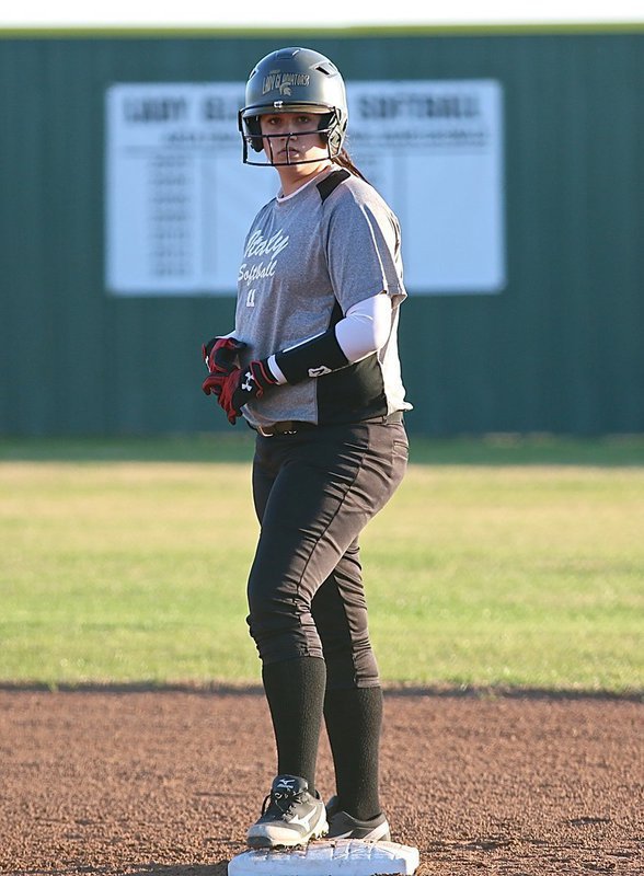 Image: Italy base runner Jenna Holden(11) awaits the play call from her coaches.