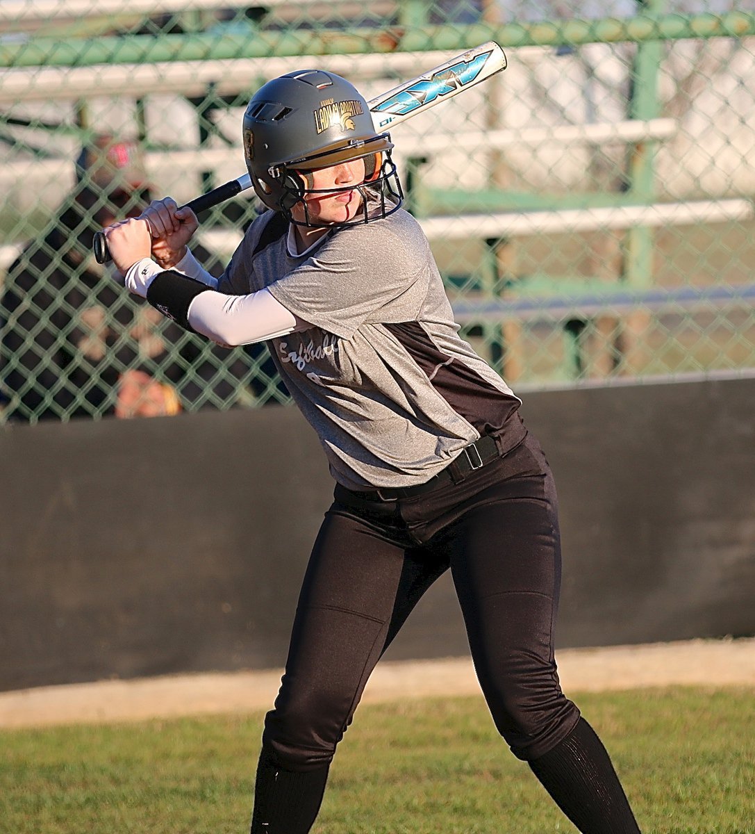 Image: Hannah Washington(8) comes thru with a three-baser for the Lady Gladiators.
