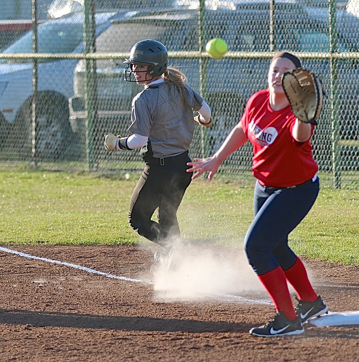 Image: Italy’s Bailey Eubank(1) beats the throw to first-base by a mile.