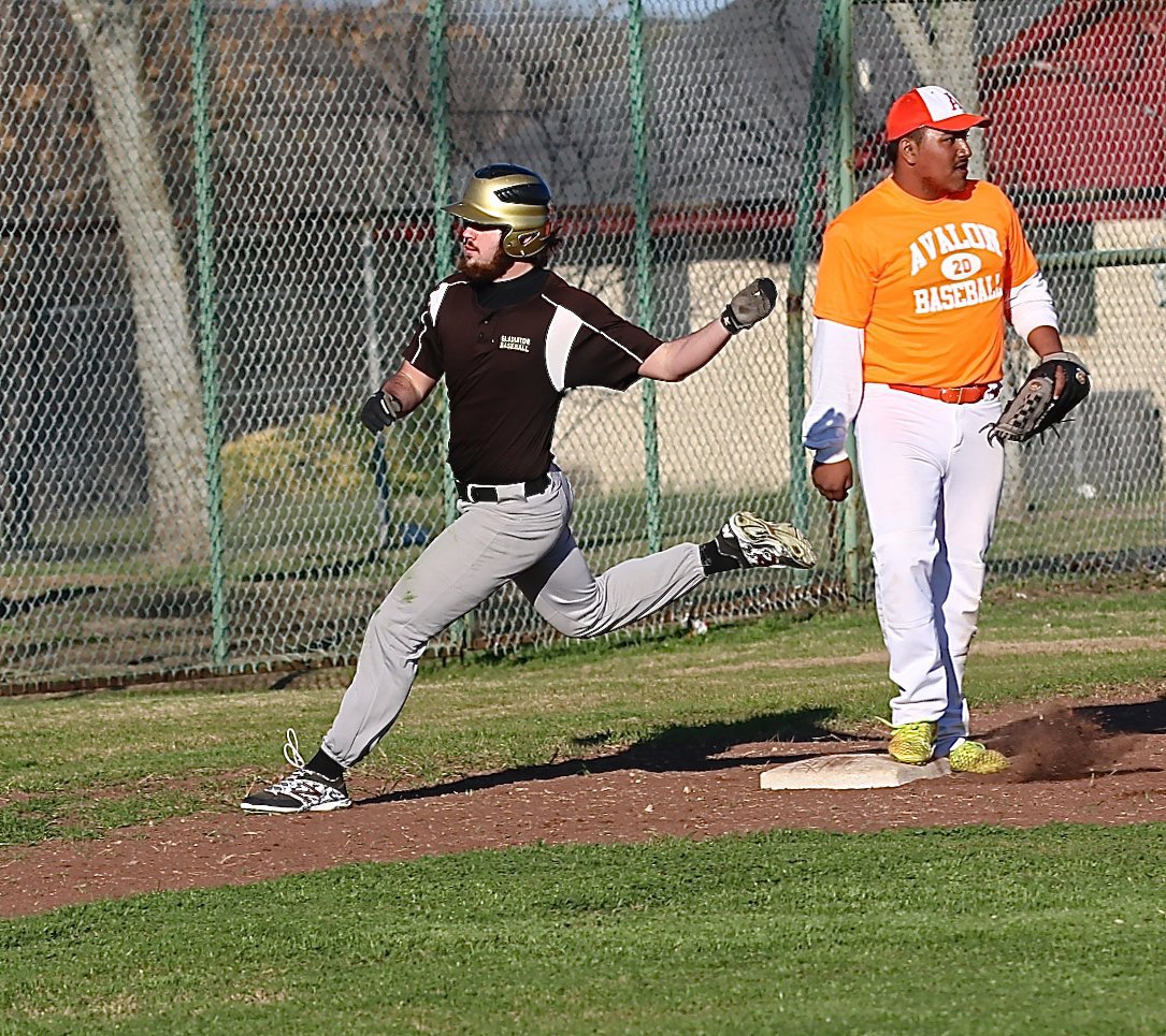 Image: Gladiator Kyle Fortenberry puts on breaks after rounding third-base.