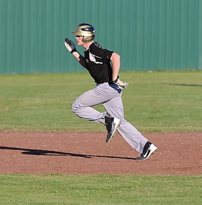 Image: Clay Riddle strides it out for a triple against Avalon.