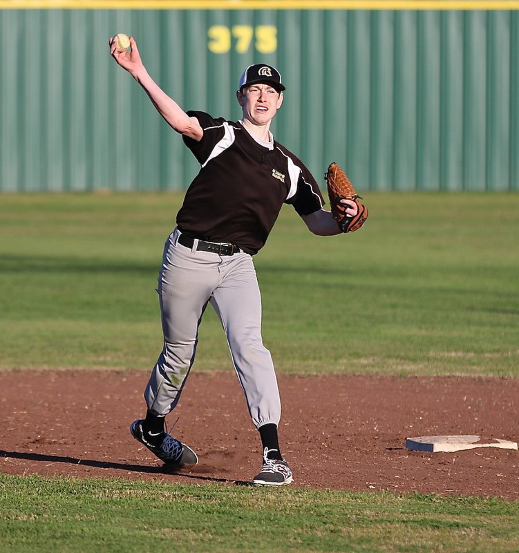 Image: Italy’s Clayton Miller warms up between innings at short.