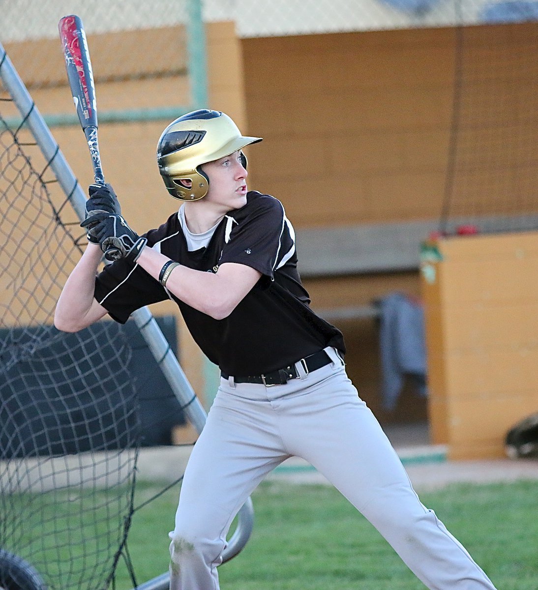 Image: Clayton Miller leans back and then swings away.