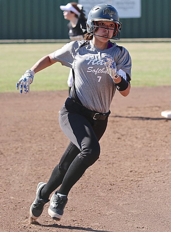 Image: Lady Gladiator April Lusk(7) keeps her eyes on head coach Tina Richards, hoping for the go sign!