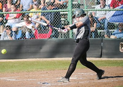 Image: Italy slugger Jaclynn Lewis(15) drives the ball past Palmer’s infielders.