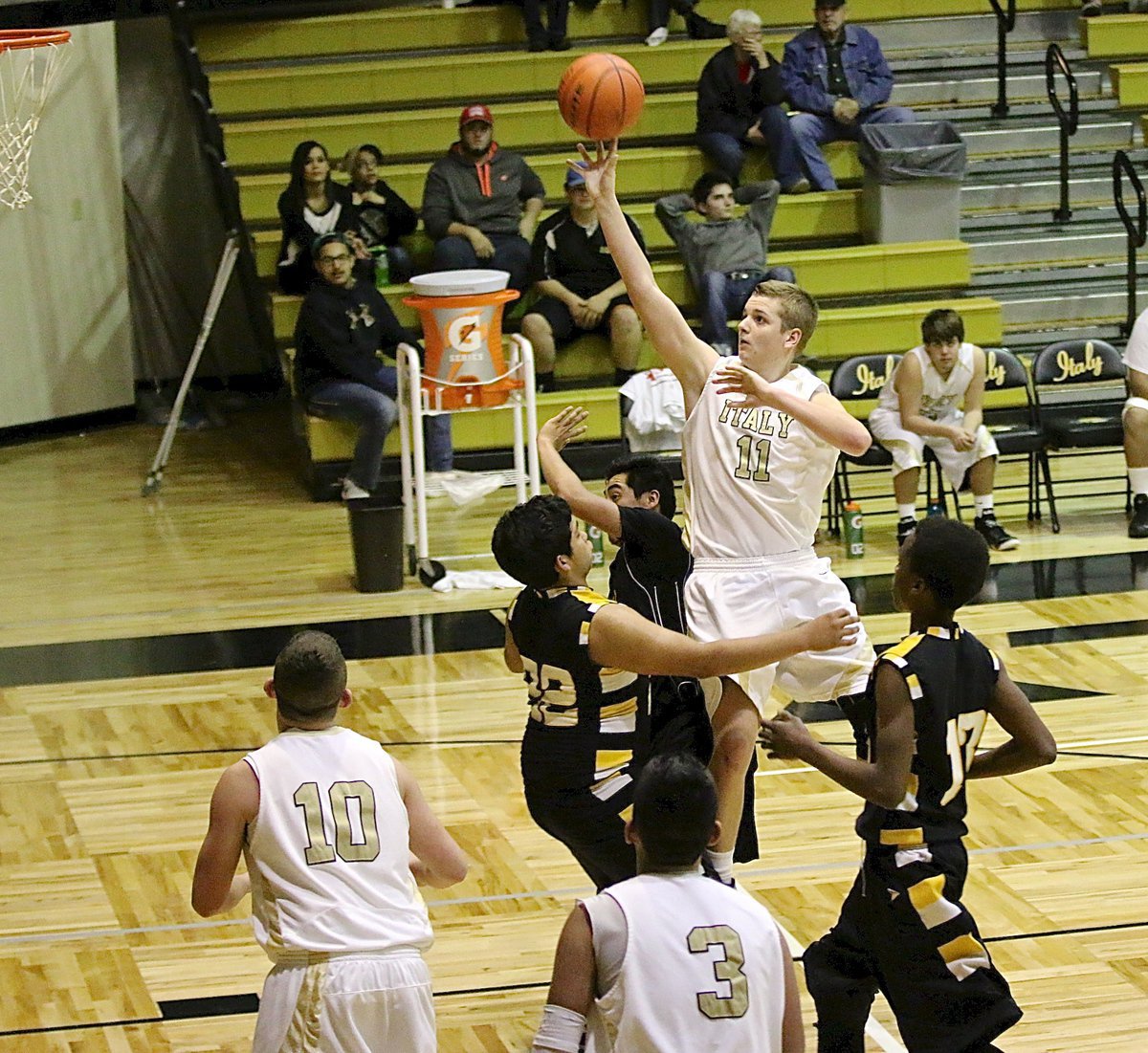Image: JV Gladiator James walton(11) attacks the paint.