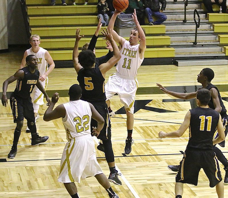 Image: Gladiator Ryan Connor(11) rises for a shot in the paint against Itasca.