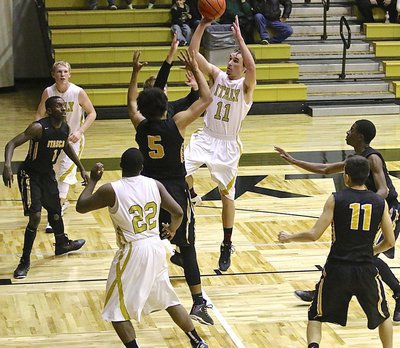 Image: Gladiator Ryan Connor(11) rises for a shot in the paint against Itasca.