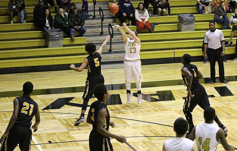 Image: Senior Gladiator John Escamilla(13) closes out the first-half by dropping in this long-range three bomb against Itasca. The shot tied the contest 25-25 at intermission.