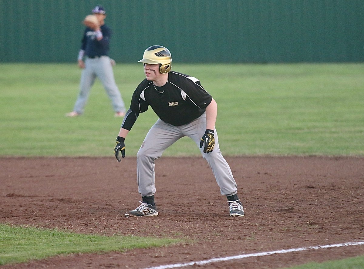 Image: Gladiator senior John Escamilla gets a lead from the first-base bag.