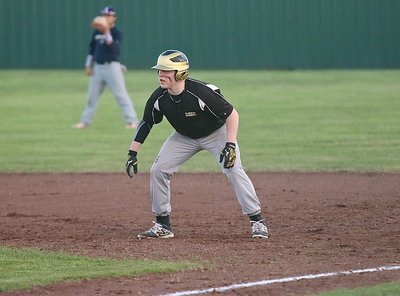 Image: Gladiator senior John Escamilla gets a lead from the first-base bag.