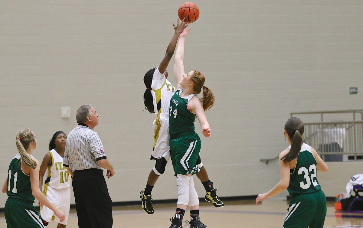 Image: Kortnei Johnson(3) controls the opening tip for the Lady Gladiators.
