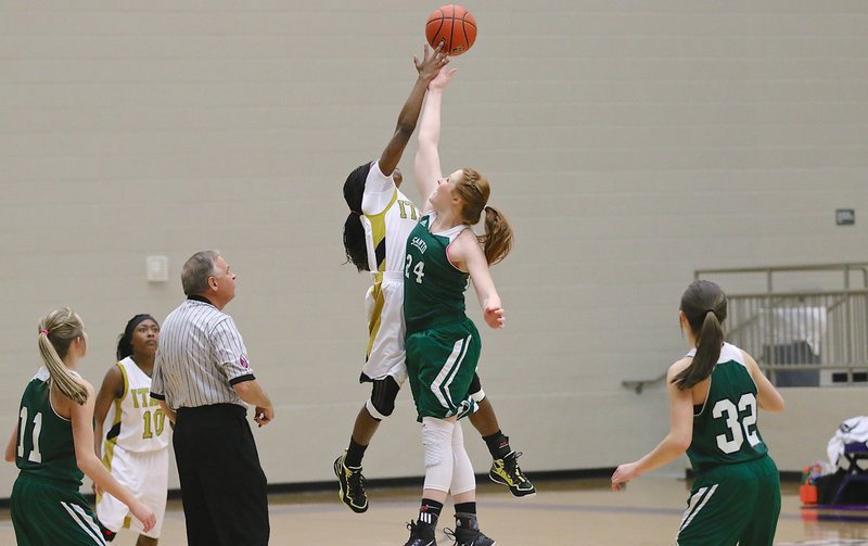 Image: Kortnei Johnson(3) controls the opening tip for the Lady Gladiators.