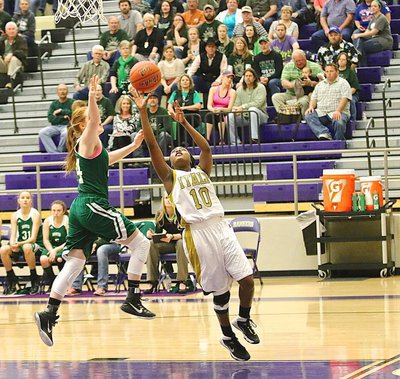 Image: Italy’s K’Breona Davis(10) is fouled after attempting a layup against Santo.